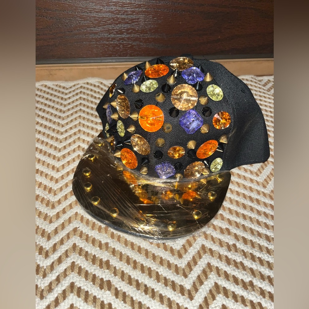New with tags youth size adjustable hat with jewels and a bright gold bill